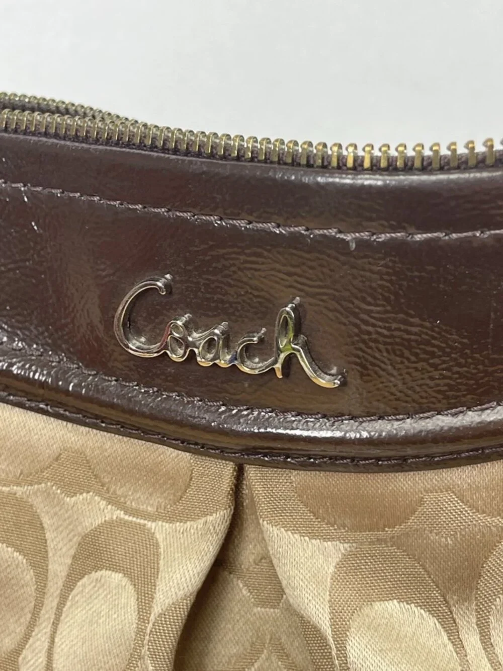 Classic older-era Coach Signature hobo bag featuring jacquard canvas and patent